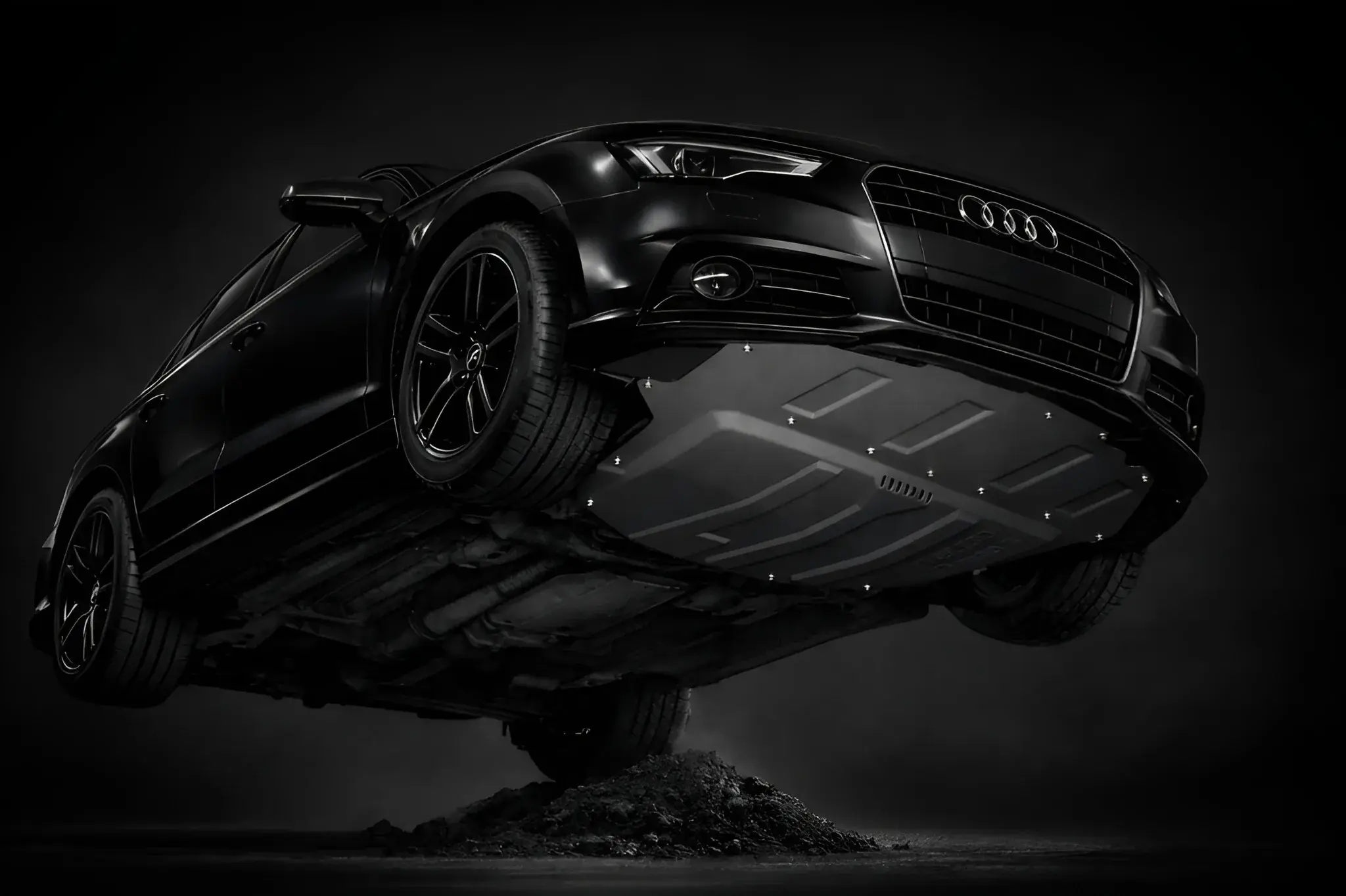 Black car with composite underbody protection